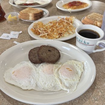 Hot Stacks - Three eggs over easy with sausage patties and hash brown potatoes. - Breakfast & Brunch Near Me - North Myrtle Beach, South Carolina Hot Stacks - Three eggs over easy with sausage patties and hash brown potatoes. - Breakfast & Brunch Near Me - North Myrtle Beach, South Carolina