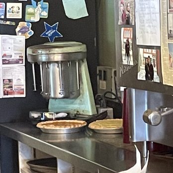 Via Main Restaurant - a kitchen counter with a mixer and pizza - Diners Near Me - Massena, New York Via Main Restaurant - a kitchen counter with a mixer and pizza - Diners Near Me - Massena, New York