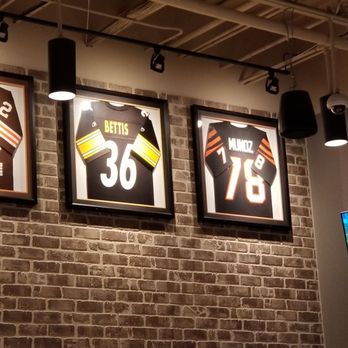 Buffalo Wild Wings - A few NFL jerseys hanging in the bar area. - Chicken Wings Near Me - Maumee, Ohio