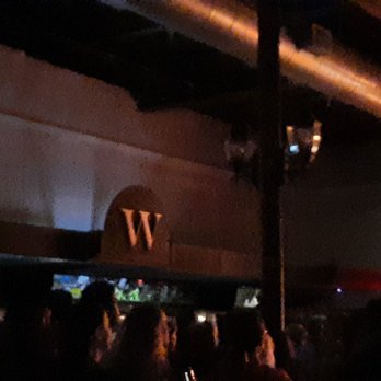 Wooly's - a crowd of people at night - Music Venues Near Me - Des Moines, Iowa