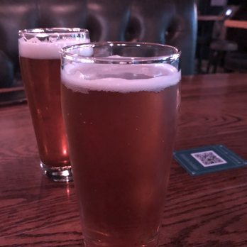 Library Square - two glasses of beer on a table - Pubs Near Me - Vancouver, British Columbia