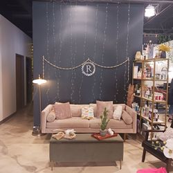Reverie Boutique & - Hang out on the couch when waiting for your salon appointment.