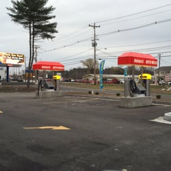 DeLuca's Auto Wash - Four vacuum stations in front