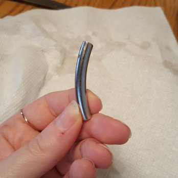 Olive Garden Italian Restaurant - Close-up of the metal piece that ended up in my leftover eggplant parmigiana. - Italian Near Me - Tarentum, Pennsylvania Olive Garden Italian Restaurant - Close-up of the metal piece that ended up in my leftover eggplant parmigiana. - Italian Near Me - Tarentum, Pennsylvania