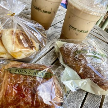 Tous Les Jours - a variety of pastries on a table - Bakeries Near Me - Austin, Texas