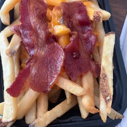 Wendy's - Two pieces of full bacon atop a baconator fry, which should have broken up pieces - possibly done out of annoyance for the customer