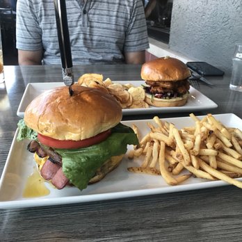 Neat Kitchen + Bar - The burger special of the month that had a patty, two Nathan's hot dogs and bacon. - Bars Near Me - Westmont, Illinois