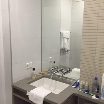 Hotel Indigo Brooklyn - A tight squeeze but a beautiful modern bathroom. Full length mirror on the inside door. - Hotels Near Me - Brooklyn, New York Hotel Indigo Brooklyn - A tight squeeze but a beautiful modern bathroom. Full length mirror on the inside door. - Hotels Near Me - Brooklyn, New York