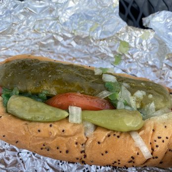 Chicago J Hot Dogs - a hot dog with pickles and tomatoes - Hot Dogs Near Me Chicago J Hot Dogs - a hot dog with pickles and tomatoes - Hot Dogs Near Me