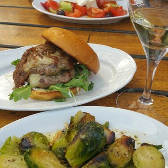 Kid Cashew - Greek salad, lamb burger, brussel sprouts, and a crisp chardonnay. Perfect lunch for two. - Mediterranean Near Me - Charlotte, North Carolina Kid Cashew - Greek salad, lamb burger, brussel sprouts, and a crisp chardonnay. Perfect lunch for two. - Mediterranean Near Me - Charlotte, North Carolina