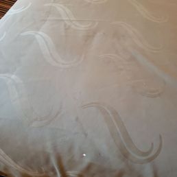 Holes and stains on bed