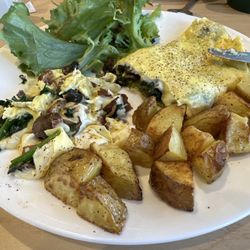 Paige's Place - A delicious breakfast @ Paige's - Bacon, mushroom, spinach and American cheese omelette with roasted potatoes and a side salad.