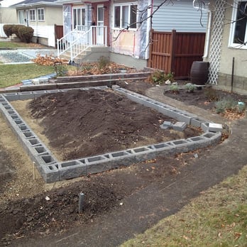 Aspen Landscape Services - a raised garden bed in front of a house - Landscaping Near Me Aspen Landscape Services - a raised garden bed in front of a house - Landscaping Near Me