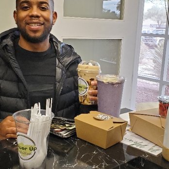 Power Up Nutrition - a man holding a cup of coffee - Juice Bars & Smoothies Near Me - Peoria, Arizona Power Up Nutrition - a man holding a cup of coffee - Juice Bars & Smoothies Near Me - Peoria, Arizona