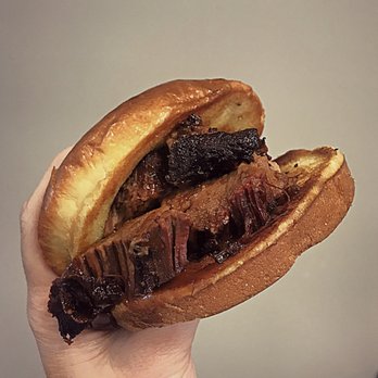 Petunia's BBQ - Petunia's "Bully" sandwich. Grilled brioche bun with sliced prime beef brisket and house-made bbq sauce. - Barbeque Near Me - Purvis, Mississippi Petunia's BBQ - Petunia's "Bully" sandwich. Grilled brioche bun with sliced prime beef brisket and house-made bbq sauce. - Barbeque Near Me - Purvis, Mississippi