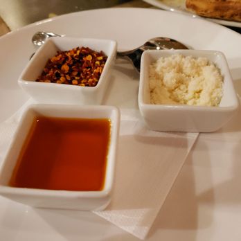 Brick Fire Tavern - Red chili flakes, Parmesan cheese, chili oil - Pizza Near Me - Honolulu, Hawaii Brick Fire Tavern - Red chili flakes, Parmesan cheese, chili oil - Pizza Near Me - Honolulu, Hawaii
