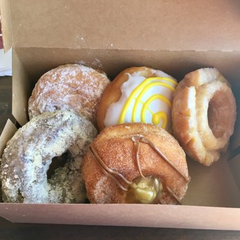Hurts Donut - first row: lemon filled, banana, old fashioned second row: blueberry struesel, apple maple EXTREMELY SWEET - Donuts Near Me - Frisco, Texas Hurts Donut - first row: lemon filled, banana, old fashioned second row: blueberry struesel, apple maple EXTREMELY SWEET - Donuts Near Me - Frisco, Texas
