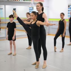 Mary Lorraine's Dance Center - Teacher at Mary Lorraine;s Dance Center assisting a dancer.