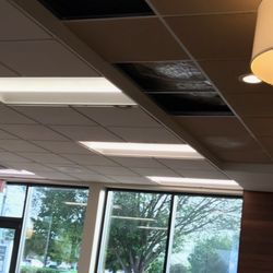 Wendy's - Exposed duct work leaking all over the floor with caution signs.