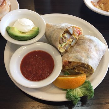 Eggscellent - Breakfast burrito with sausage. Served with a side of avocado, sour cream, and salsa. - Breakfast & Brunch Near Me - Las Vegas, Nevada