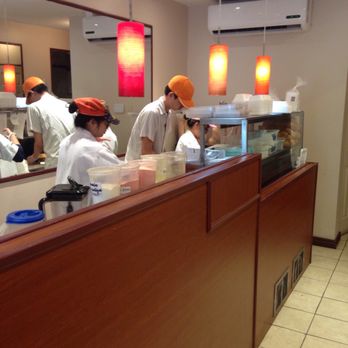 Viet Express - a group of chefs preparing food in a restaurant - Vietnamese Near Me - Montreal, Quebec