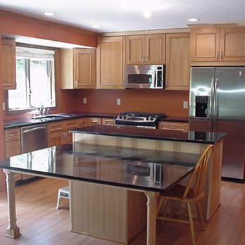 Black Bear Builders - a kitchen with stainless steel appliances - General Contractors Near Me