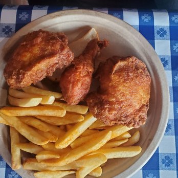 Gus's World Famous Fried Chicken - Two piece dark plate with French fries - Chicken Shop Near Me - Chamblee, Georgia
