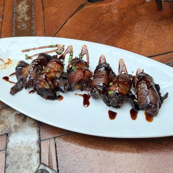 Hervé - Bacon wrapped stuffed dates... - Wine Bars Near Me - Santa Fe, New Mexico