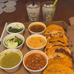 Taco box with beans, rice, salsa and fixins