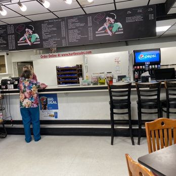 Hartle's Subs - a woman standing at the counter - Sandwiches Near Me - Hagerstown, Maryland Hartle's Subs - a woman standing at the counter - Sandwiches Near Me - Hagerstown, Maryland