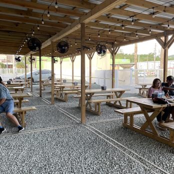 El Tenedor De Mario - people sitting at picnic tables - Puerto Rican Near Me El Tenedor De Mario - people sitting at picnic tables - Puerto Rican Near Me