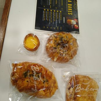 Emma Bakes - Clockwise from the top left: Egg tart, garlic pastry, strawberry - cream cheese pastry, sausage cheese bread. - Patisserie/Cake Shop Near Me - Lincoln, Nebraska