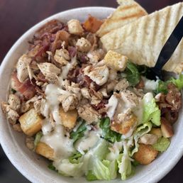 Grilled chicken Caesar salad, croutons, Parmesan cheese, and bacon Grilled chicken Caesar salad, croutons, Parmesan cheese, and bacon