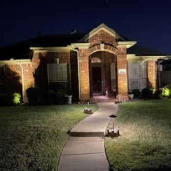 Secret Gardens - the front of a house at night - Landscaping Near Me Secret Gardens - the front of a house at night - Landscaping Near Me