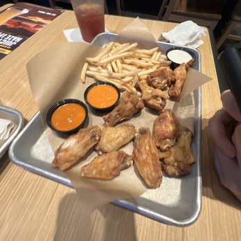 Buffalo Wild Wings - a tray of fries and dipping sauces - Sports Bars Near Me - Huntsville, Texas Buffalo Wild Wings - a tray of fries and dipping sauces - Sports Bars Near Me - Huntsville, Texas