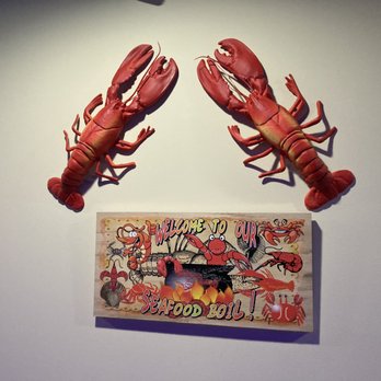 Ragin Cajun Seafood - two red lobsters on a white wall - Cajun/Creole Near Me - Madison, Wisconsin Ragin Cajun Seafood - two red lobsters on a white wall - Cajun/Creole Near Me - Madison, Wisconsin