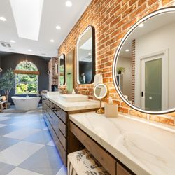 TS Construction - Bright, bold, and beautifully functional.
A long vanity with ample counter space and mirrors for a flawless start to every day.