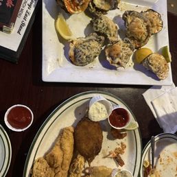 Floyd seafood platter with fried okra, grilled oyster, Lafayette oyster, Rockefeller, black and butter, crab oyster.