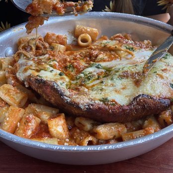 Carmelina's - Chicken Parmesan. A massive portion with so much melty cheese. - Italian Near Me - Boston, Massachusetts Carmelina's - Chicken Parmesan. A massive portion with so much melty cheese. - Italian Near Me - Boston, Massachusetts