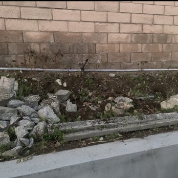 Premier Pools & Spas - Where there subcontractors threw what they were too lazy to dispose of when they made the sheers for the waterfall - Pool & Hot Tub Service Near Me - Ontario, California Premier Pools & Spas - Where there subcontractors threw what they were too lazy to dispose of when they made the sheers for the waterfall - Pool & Hot Tub Service Near Me - Ontario, California