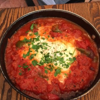 Aish Tanoor - a pan of food on a table - Kosher Near Me - Toronto, Ontario