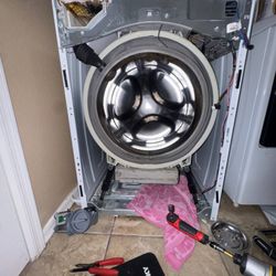 DT Appliance Repair & Solutions - Whirlpool washer not draining, loud pump noise, and water stuck inside -- machine completely out of service.
