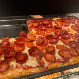 a slice of pepperoni pizza a slice of pepperoni pizza