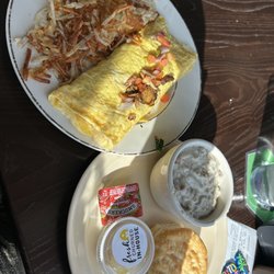 Farmhouse Restaurant At Harvest Market - Veggie omelet, Hash brown with a side of biscuit and gravy.