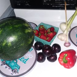 Willie's Farm Market - Watermelon, strawberries, sweet onion, two sizes of garlic, plums a d a red bell pepper.