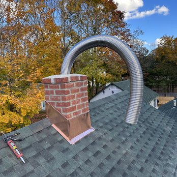 EM Certified Construction - New chimney, new liner system, new copper flashing - Roofing Near Me