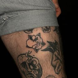 Royal Sword Tattoo & Piercing - A few tattoos from Royal a skull, a moon smoking a cig, the logo for a radio station in Cleveland