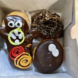 Voodoo Doughnut - 4 flavors I picked - Mango Tango, The Dirt, Portland Cream, Voodoo Doll