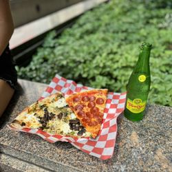 Norm's Pizza - Pepperoni slice, Garlic slice and a Topo Chico Seltzer for $13