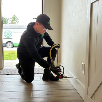 Dever Pest Control - Applying a liquid termite treatment inside a wall cavity to protect the home from active termite activity. - Pest Control Near Me - Opa-locka, Florida Dever Pest Control - Applying a liquid termite treatment inside a wall cavity to protect the home from active termite activity. - Pest Control Near Me - Opa-locka, Florida